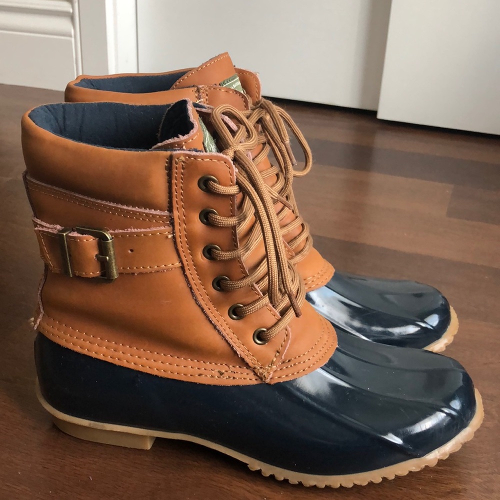 Brown and navy duck boots